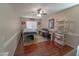 Home office with wood floors, desk, and built-in shelving at 4254 S Winter Ln, Gilbert, AZ 85297