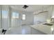 Kitchen with white cabinets, view of backyard access at 568 N Sirrine --, Mesa, AZ 85201