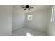 Spacious bedroom with a window and ceiling fan at 568 N Sirrine --, Mesa, AZ 85201