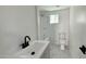 Clean bathroom with a shower/tub combo, toilet, and modern vanity at 568 N Sirrine --, Mesa, AZ 85201