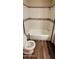 Clean bathroom with tub, toilet and wood-look flooring at 120 N Val Vista Dr # 86, Mesa, AZ 85213