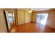 Bright bedroom with wood floors, large closet, and access to a bathroom at 120 N Val Vista Dr # 86, Mesa, AZ 85213