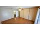 Spacious bedroom with wood floors and mirrored closet doors at 120 N Val Vista Dr # 86, Mesa, AZ 85213