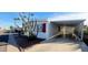 Nice manufactured home with carport and desert landscaping at 120 N Val Vista Dr # 86, Mesa, AZ 85213