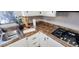 Kitchen detail showing gas cooktop and ample counter space at 120 N Val Vista Dr # 86, Mesa, AZ 85213