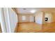 Living room with hardwood floors and views to the kitchen and dining areas at 120 N Val Vista Dr # 86, Mesa, AZ 85213