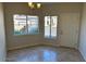 Bright dining area with large windows and tile flooring at 3236 E Chandler Blvd # 1033, Phoenix, AZ 85048