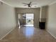 Living room with fireplace, sliding door to patio, and tile floors at 3236 E Chandler Blvd # 1033, Phoenix, AZ 85048