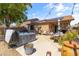 Relaxing backyard oasis with hot tub, patio furniture, and solar panels at 16241 W Hearn Rd, Surprise, AZ 85379