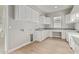 Bright laundry room with white cabinets and wood-look flooring at 17871 E Paria Canyon Dr, Rio Verde, AZ 85263