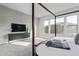 Main bedroom with a four-poster bed and ample natural light at 17871 E Paria Canyon Dr, Rio Verde, AZ 85263