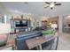 Spacious living room featuring comfortable seating and built-in entertainment center at 35532 N Sunset Trl, San Tan Valley, AZ 85140