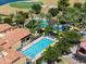 Aerial view of community pool, spa and clubhouse with resort-style amenities at 35532 N Sunset Trl, San Tan Valley, AZ 85140