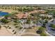 Aerial view of community clubhouse with parking lot and palm trees at 35532 N Sunset Trl, San Tan Valley, AZ 85140