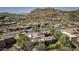 View of home with solar panels and desert mountain backdrop at 10746 E Whitethorn Dr, Scottsdale, AZ 85262