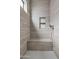 Modern shower with built-in bench and shelf at 2526 W Fernwood Dr, Phoenix, AZ 85086