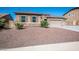 House exterior showcasing stone accents and a two-car garage at 43856 N Hudson Trl, New River, AZ 85087