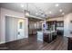 Kitchen boasts a large island, stainless steel appliances, and views to the living room at 43856 N Hudson Trl, New River, AZ 85087
