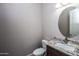 Clean bathroom with granite vanity and an oval mirror at 43856 N Hudson Trl, New River, AZ 85087