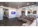 Spacious living area showcasing an open floor plan with kitchen views at 43856 N Hudson Trl, New River, AZ 85087