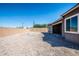 Large backyard with gravel and a view of a block wall at 43856 N Hudson Trl, New River, AZ 85087