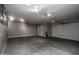 Spacious three-car garage with epoxy flooring and ample storage space at 43856 N Hudson Trl, New River, AZ 85087