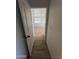 Bright hallway with wood-look floors leading to bedroom at 35624 W Harrison St, Tonopah, AZ 85354