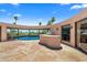 Inviting pool area with flagstone patio and built-in grill at 6841 N 58Th Pl, Paradise Valley, AZ 85253