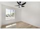 Well-lit bedroom featuring a large window and ceiling fan at 1036 E Grandview St, Mesa, AZ 85203