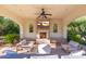 Relaxing covered patio with fireplace and seating area at 6630 E Stallion Rd, Paradise Valley, AZ 85253