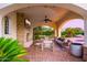 Relaxing outdoor lounge area with seating and a fireplace at 6630 E Stallion Rd, Paradise Valley, AZ 85253