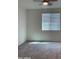 Bright bedroom with ceiling fan and neutral decor at 5513 W San Gabriel Ave, Laveen, AZ 85339