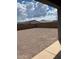 Large backyard with gravel landscaping and mountain views at 5513 W San Gabriel Ave, Laveen, AZ 85339