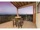 Private patio with stunning sunset views and a bistro table at 6275 E Jacob Waltz St, Apache Junction, AZ 85119