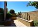 Landscaped courtyard with cacti, stone walls, and a seating area at 23014 N 86Th St, Scottsdale, AZ 85255