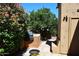 Outdoor kitchen with built-in grill and stone countertops at 23014 N 86Th St, Scottsdale, AZ 85255