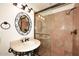 Updated bathroom with glass shower and decorative mirror at 23014 N 86Th St, Scottsdale, AZ 85255
