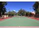 Well-maintained tennis court with surrounding landscape at 23014 N 86Th St, Scottsdale, AZ 85255