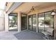Covered patio with sliding glass doors and ceiling fan at 23014 N 86Th St, Scottsdale, AZ 85255
