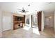Home office with built-in shelving and courtyard views at 23014 N 86Th St, Scottsdale, AZ 85255