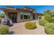 Landscaped backyard with patio, fire pit and grill at 36131 N Desert Tea Dr, Queen Creek, AZ 85140