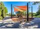 Community playground with shade structure and play equipment at 36131 N Desert Tea Dr, Queen Creek, AZ 85140
