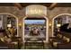 Elegant lobby with comfortable seating and views to outdoor patio at 36131 N Desert Tea Dr, Queen Creek, AZ 85140