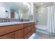 Bathroom with double sinks, a tub, and a shower at 36131 N Desert Tea Dr, Queen Creek, AZ 85140