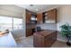 Bright home office with built-in desk and storage at 36131 N Desert Tea Dr, Queen Creek, AZ 85140