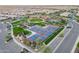 Aerial view of community pickleball courts and surrounding green space at 36131 N Desert Tea Dr, Queen Creek, AZ 85140