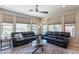 Bright Gathering room with large windows, comfortable seating, and a cozy atmosphere at 36131 N Desert Tea Dr, Queen Creek, AZ 85140