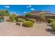 Landscaped backyard with patio and fire pit at 36131 N Desert Tea Dr, Queen Creek, AZ 85140