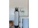Water softener and filtration system in garage at 36131 N Desert Tea Dr, Queen Creek, AZ 85140