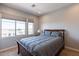 Cozy bedroom with a comfortable bed and natural light at 36131 N Desert Tea Dr, Queen Creek, AZ 85140